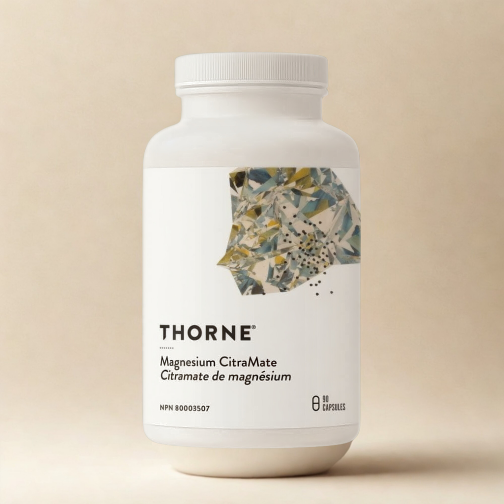 Thorne Magnesium CitraMate supplement bottle with a minimalist white label and abstract geometric artwork, displayed against a warm beige background, showing 90 capsules on the label.